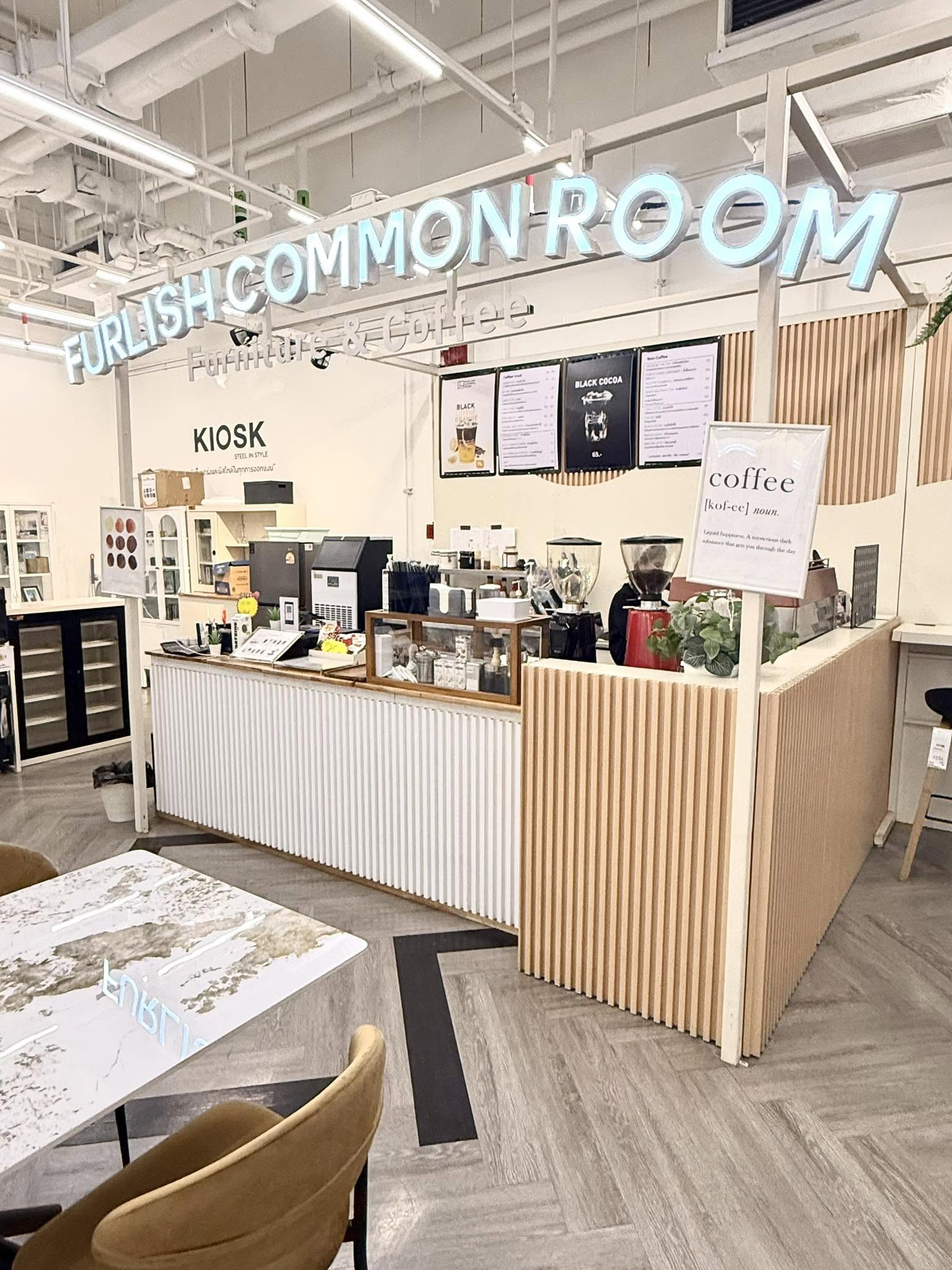Furlish Common Room interior — coffee counter and furniture showroom